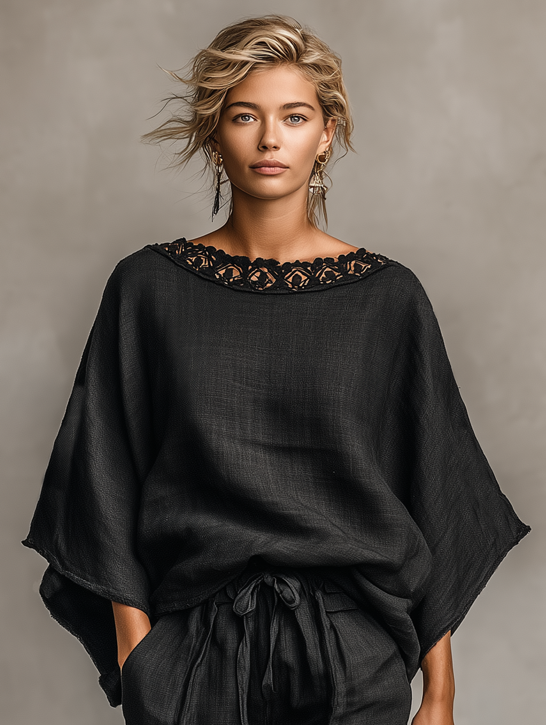 Black - A woman models a relaxed-fit woven shorts set featuring a boat neckline with crochet trim, dolman sleeves, and drawstring waist shorts, styled with a large woven tote bag.