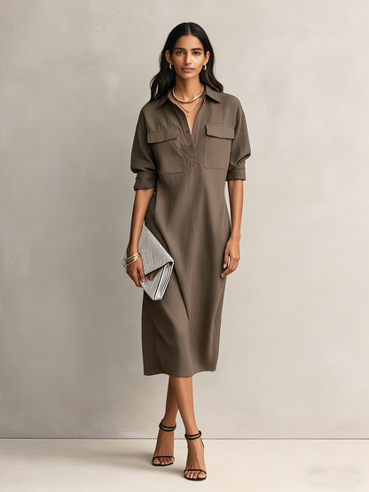Cool Brown - Model wearing a relaxed fit collared midi shirtdress with chest pockets and rolled sleeves, styled with gold jewelry and strappy heels
