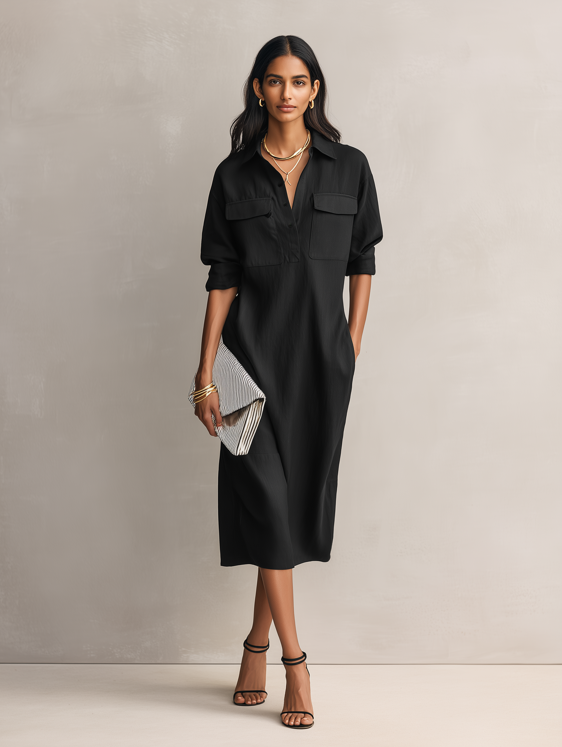 Apricot - Model wearing a relaxed fit collared midi shirtdress with chest pockets and rolled sleeves, styled with gold jewelry and strappy heels