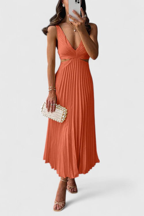 Orange - A woman wearing a pale yellow pleated satin midi dress with a plunging V-neckline and side waist cutouts, holding a pearl-embellished clutch.