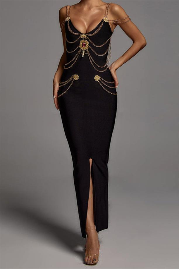 Woman wearing black bandage dress with gold chain detail