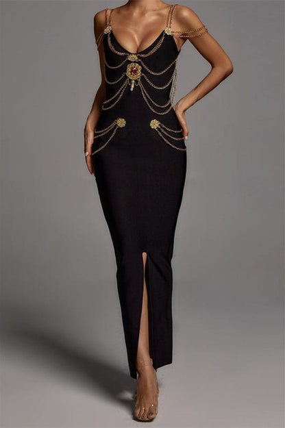 Woman wearing black bandage dress with gold chain detail