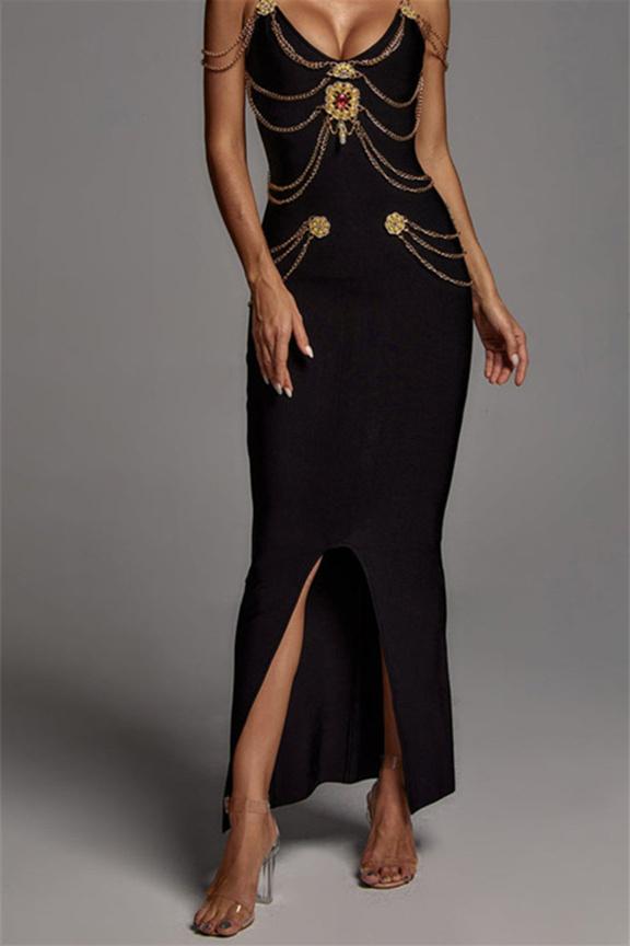 Woman wearing black bandage dress with gold chain detail