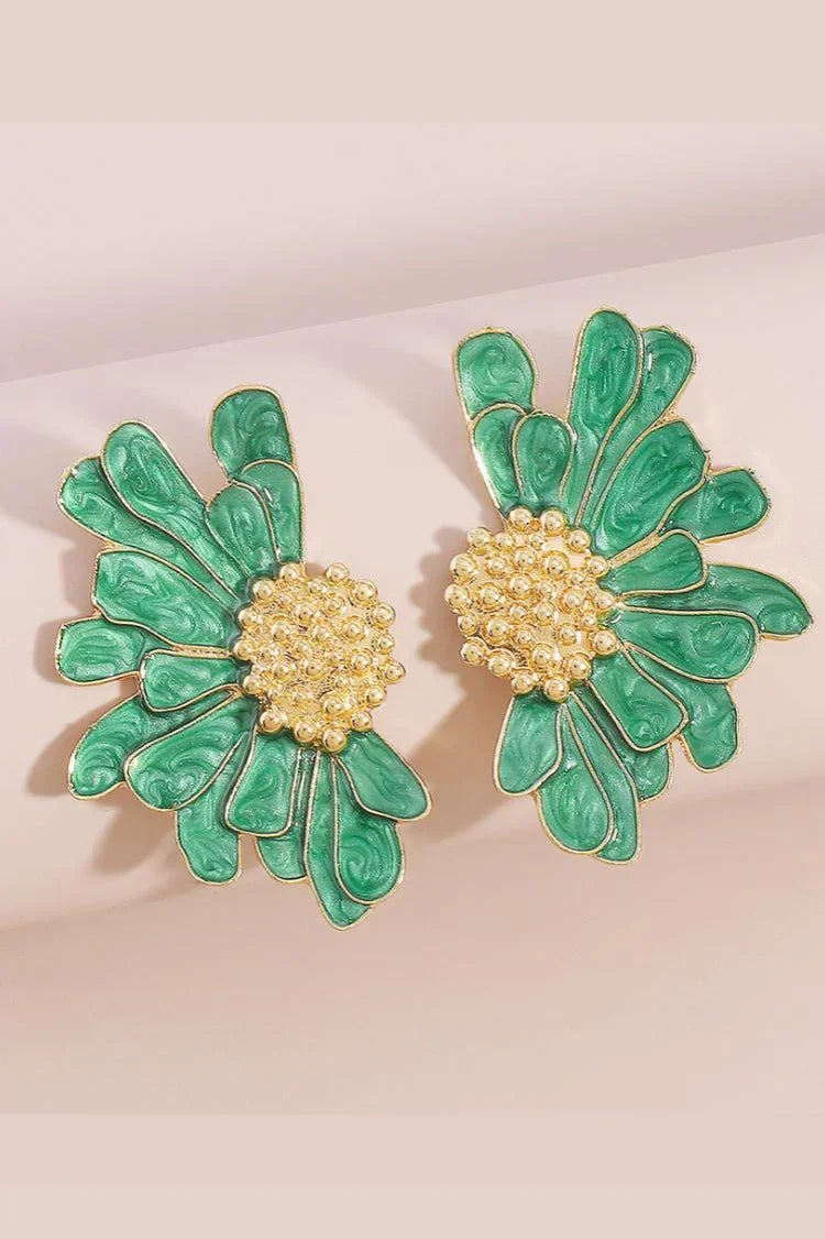 Close up of green enamel flower earring with gold plated center