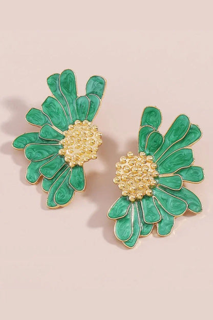 Close up of green enamel flower earring with gold plated center