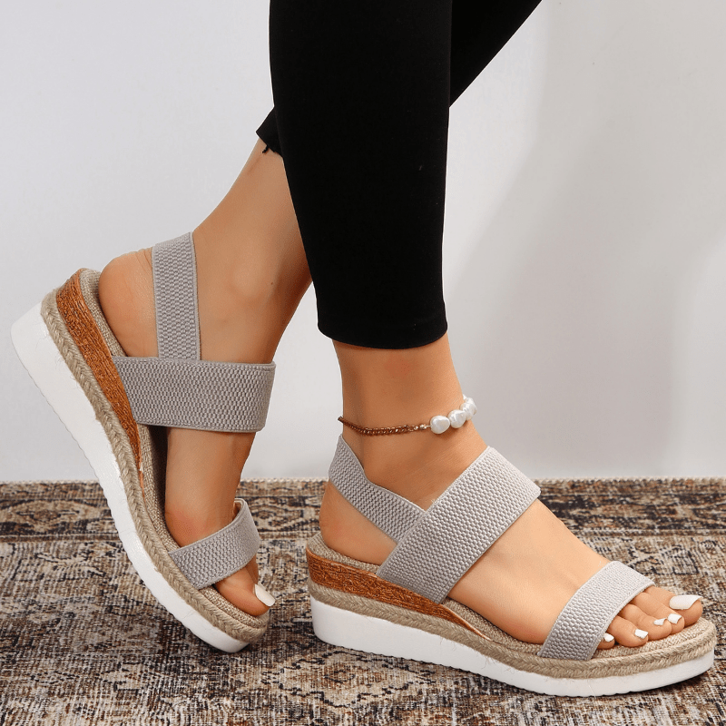 Grey - Women's open-toe platform sandals featuring wide stretch-fabric straps, a cushioned footbed, and a layered sole with jute-trim detailing.