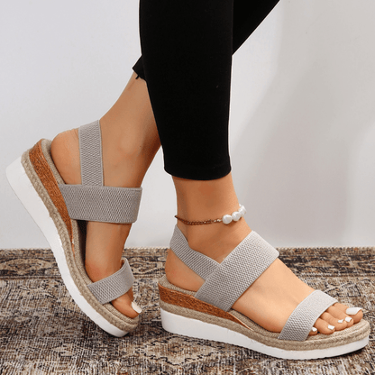 Grey - Women's open-toe platform sandals featuring wide stretch-fabric straps, a cushioned footbed, and a layered sole with jute-trim detailing.
