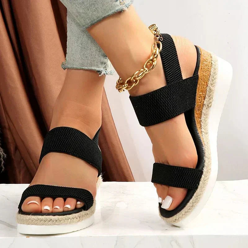 Black (Almost sold out) - Women's open-toe platform sandals featuring wide stretch-fabric straps, a cushioned footbed, and a layered sole with jute-trim detailing.