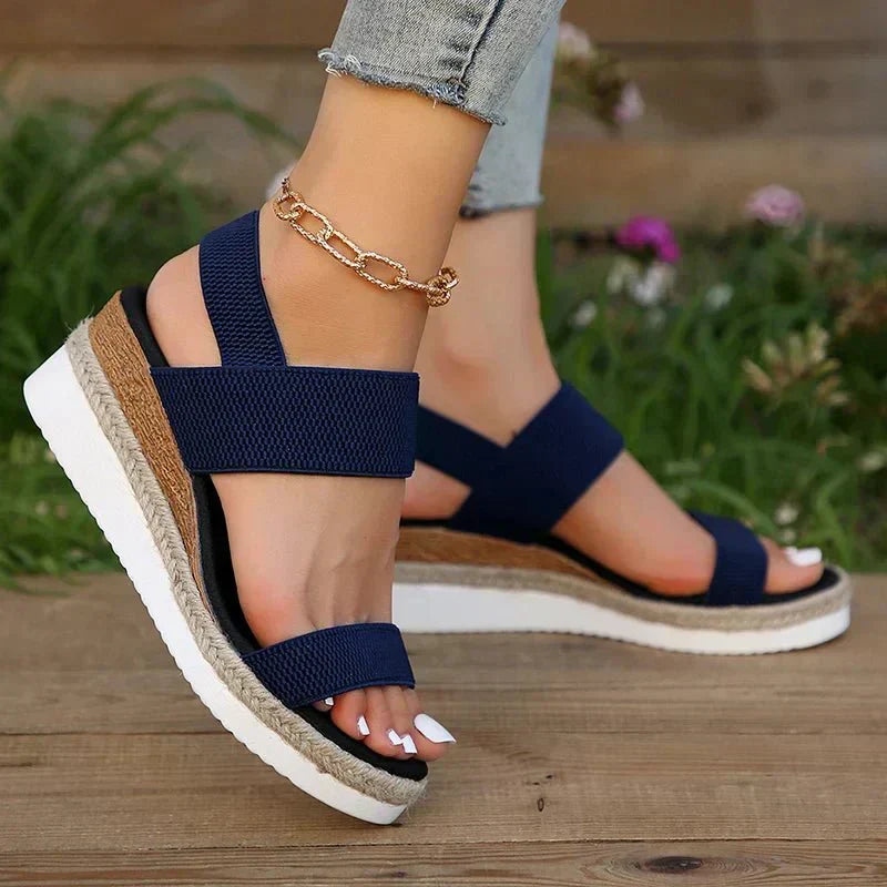 Pink - Women's open-toe platform sandals featuring wide stretch-fabric straps, a cushioned footbed, and a layered sole with jute-trim detailing.