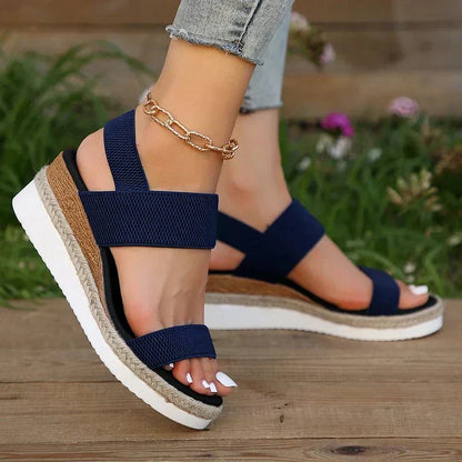 Pink - Women's open-toe platform sandals featuring wide stretch-fabric straps, a cushioned footbed, and a layered sole with jute-trim detailing.