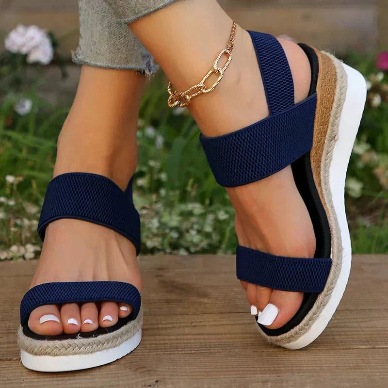 Pink - Women's open-toe platform sandals featuring wide stretch-fabric straps, a cushioned footbed, and a layered sole with jute-trim detailing.