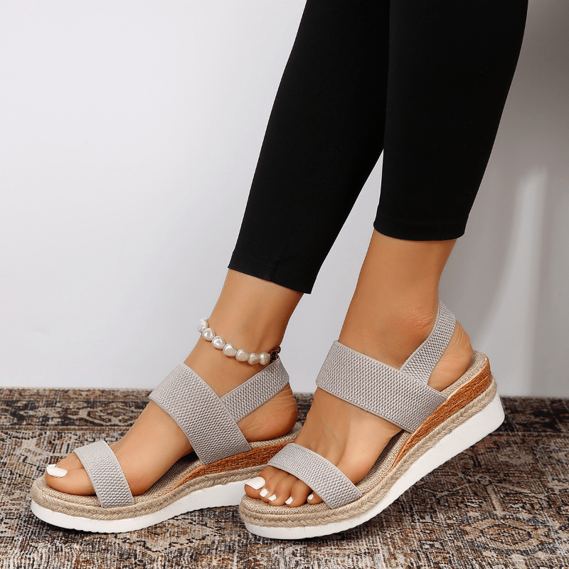 Pink - Women's open-toe platform sandals featuring wide stretch-fabric straps, a cushioned footbed, and a layered sole with jute-trim detailing.