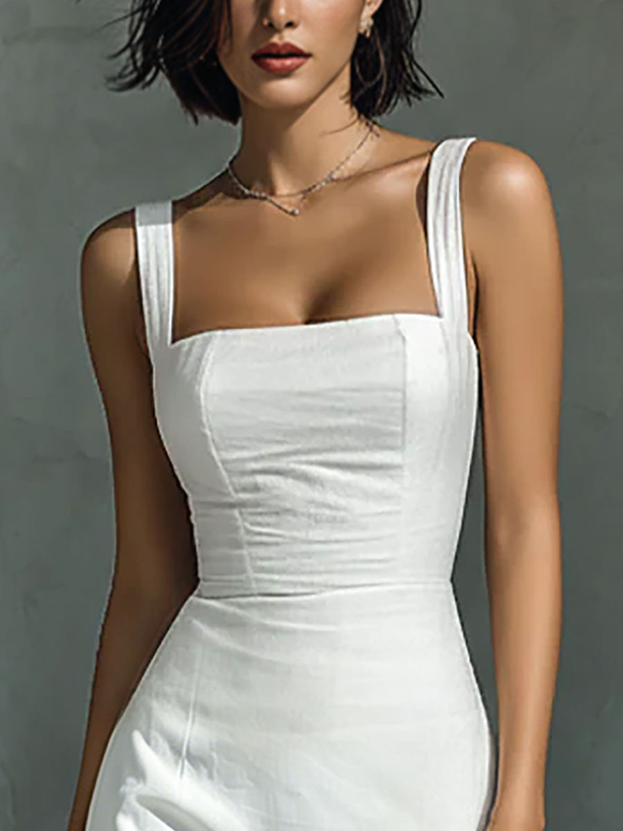 Model wearing a solid square-neck sleeveless maxi dress with a fitted bodice and straight skirt, standing against a textured grey wall.
