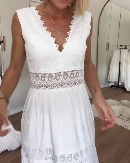 White - Woman wearing a sleeveless V-neck tiered maxi sundress featuring intricate crochet waist paneling and trim details.