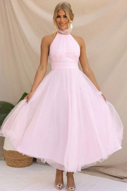 Pink - Woman wearing a sleeveless tulle midi dress with a sheer halter neckline and structured corset bodice