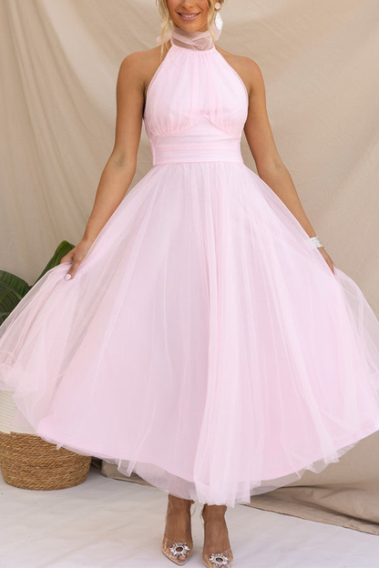 Pink - Woman wearing a sleeveless tulle midi dress with a sheer halter neckline and structured corset bodice