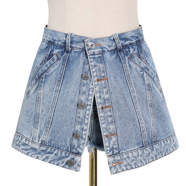 Woman wearing light wash denim skort with button detail