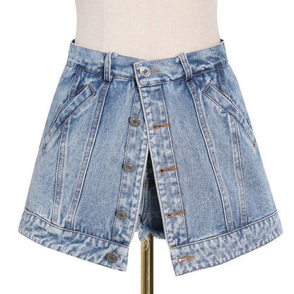 Woman wearing light wash denim skort with button detail