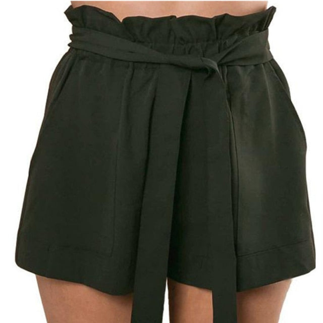 Woman wearing mocha brown paperbag waist shorts with tie.