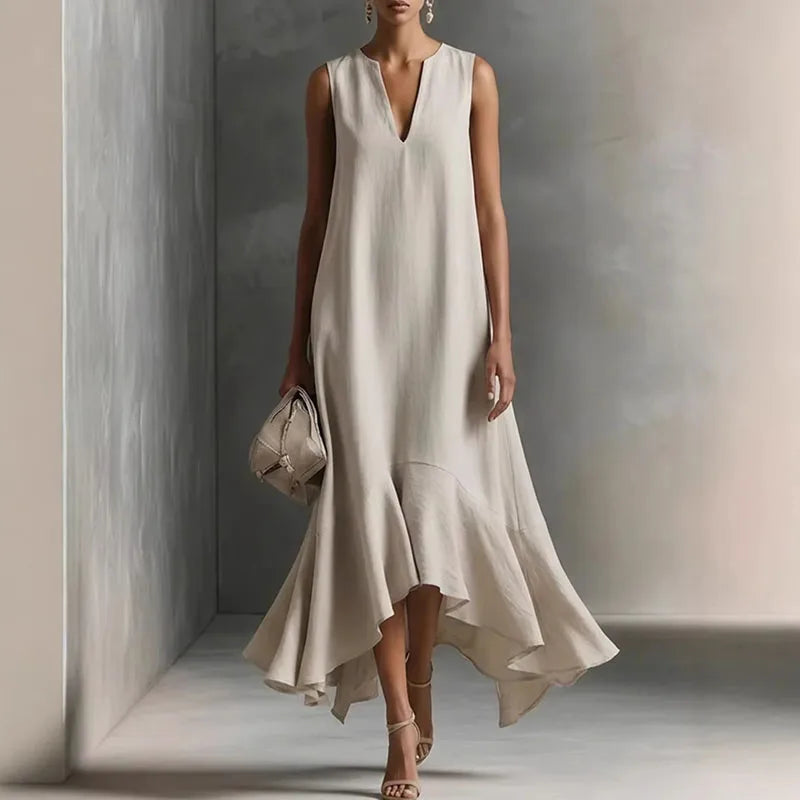 Hemp - Woman wearing a sleeveless V-neck maxi dress with an asymmetrical ruffle hem.