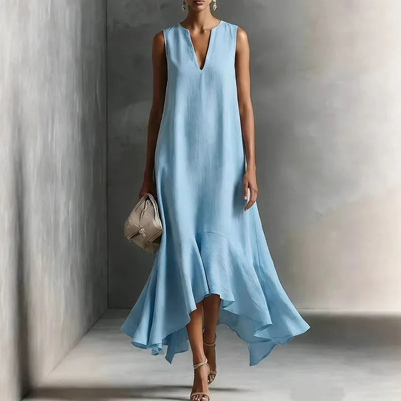 Light Blue - Woman wearing a sleeveless V-neck maxi dress with an asymmetrical ruffle hem.