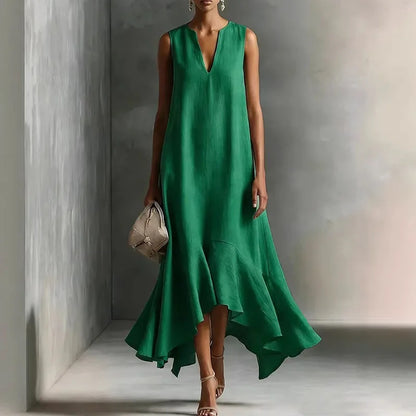 Green - Woman wearing a sleeveless V-neck maxi dress with an asymmetrical ruffle hem.
