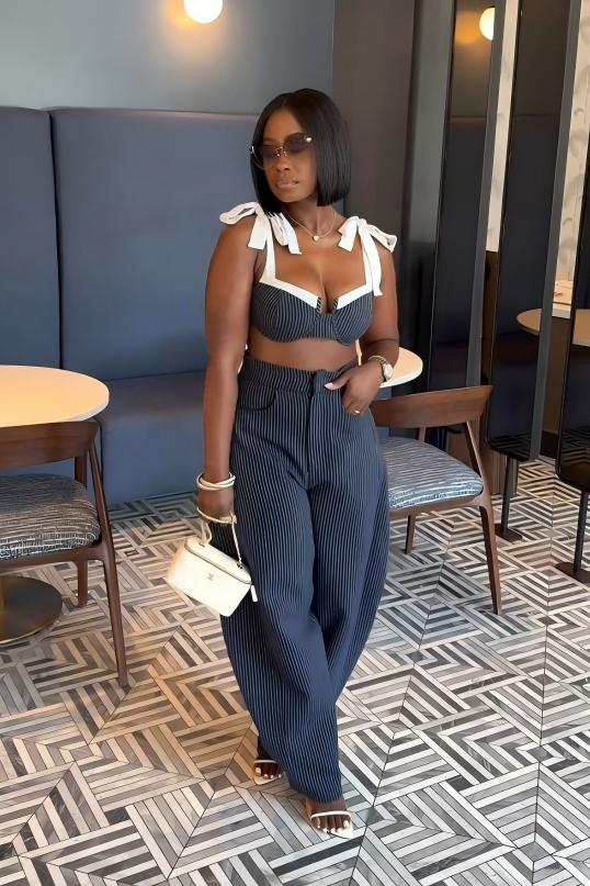 Woman in blue and white striped two-piece set