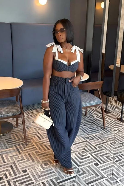 Woman in blue and white striped two-piece set