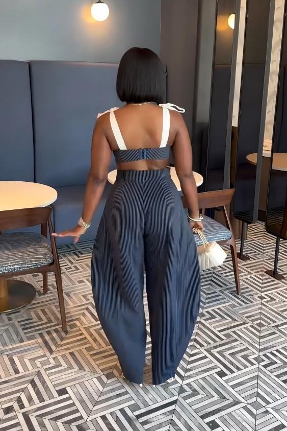 Woman in blue and white striped two-piece set