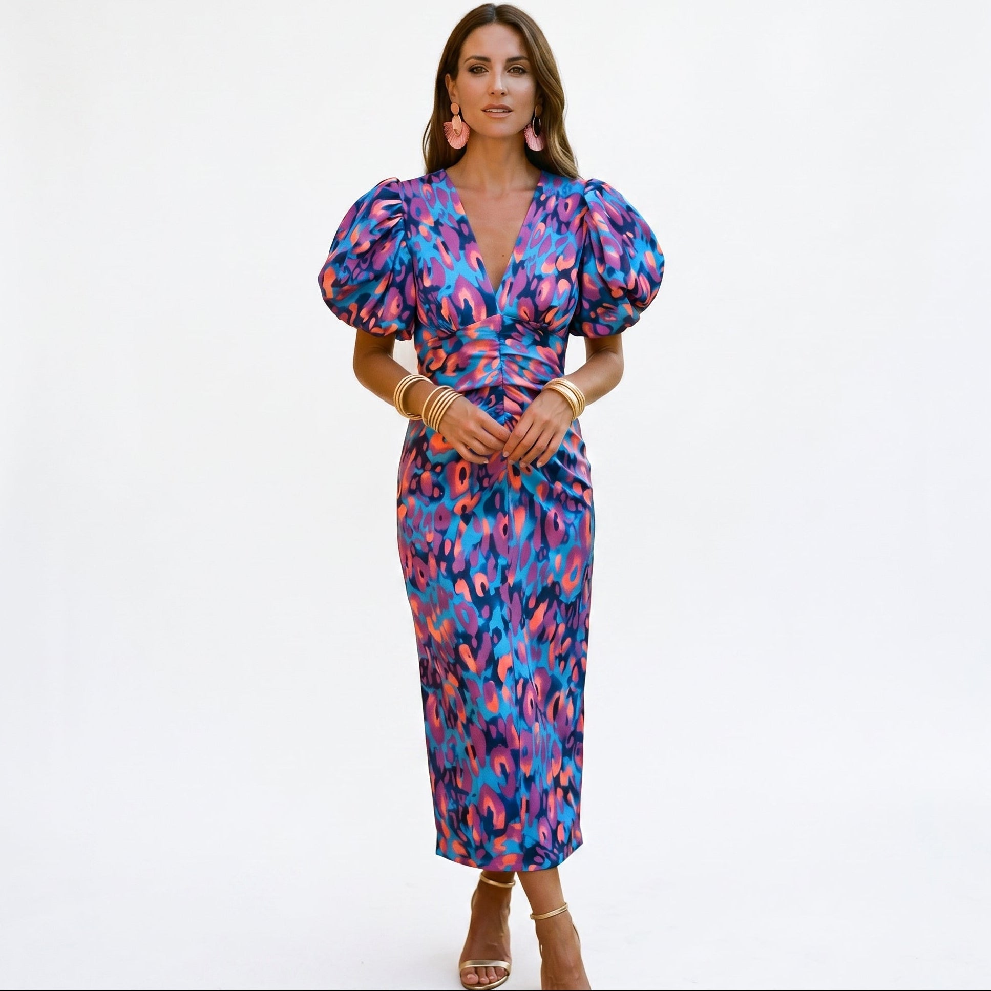 Purple - Model wearing a woven abstract pattern midi dress featuring short puff sleeves, a deep V-neckline, and a heavily ruched center bodice against a white background.