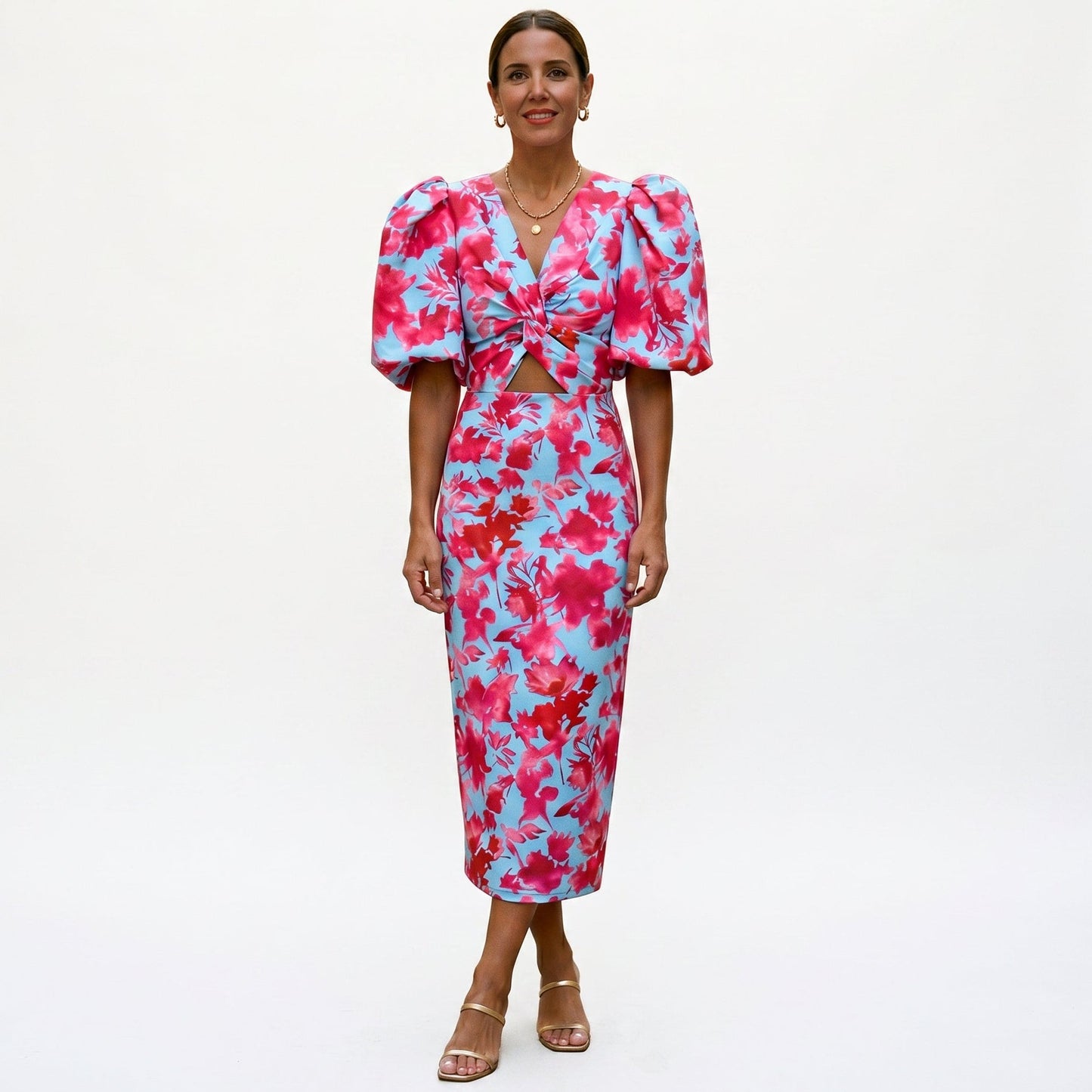Pink - Model wearing a woven abstract pattern midi dress featuring short puff sleeves, a deep V-neckline, and a heavily ruched center bodice against a white background.