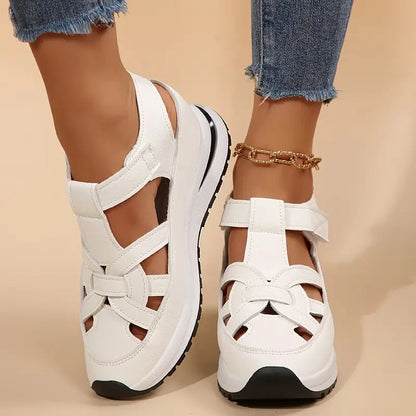White - Women's faux-leather platform sandals featuring a woven cutout upper design, thick shock-absorbing sole, and adjustable hook-and-loop ankle strap.