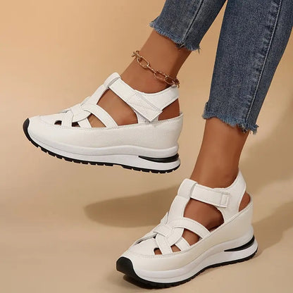 White - Women's faux-leather platform sandals featuring a woven cutout upper design, thick shock-absorbing sole, and adjustable hook-and-loop ankle strap.