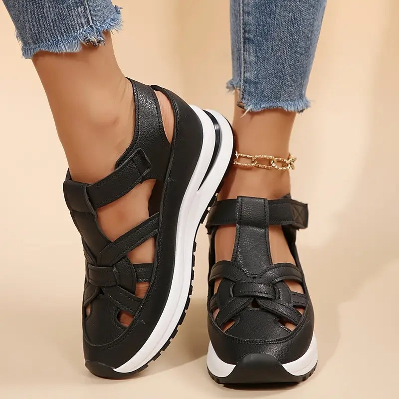 Black - Women's faux-leather platform sandals featuring a woven cutout upper design, thick shock-absorbing sole, and adjustable hook-and-loop ankle strap.