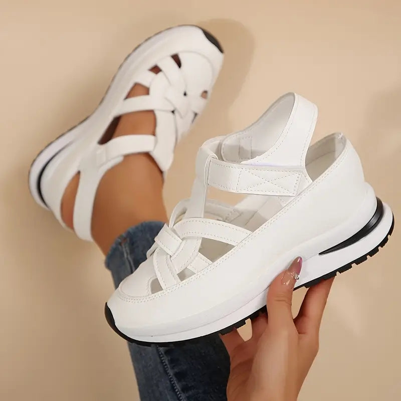 Black - Women's faux-leather platform sandals featuring a woven cutout upper design, thick shock-absorbing sole, and adjustable hook-and-loop ankle strap.