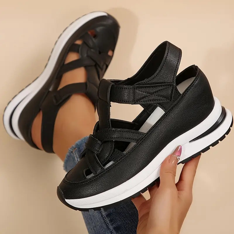 Black - Women's faux-leather platform sandals featuring a woven cutout upper design, thick shock-absorbing sole, and adjustable hook-and-loop ankle strap.