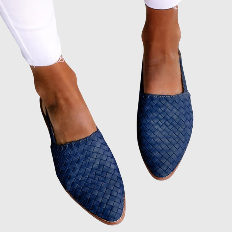 Blue - Women's flat slip-on mules featuring a woven faux-leather upper and closed almond toe design.