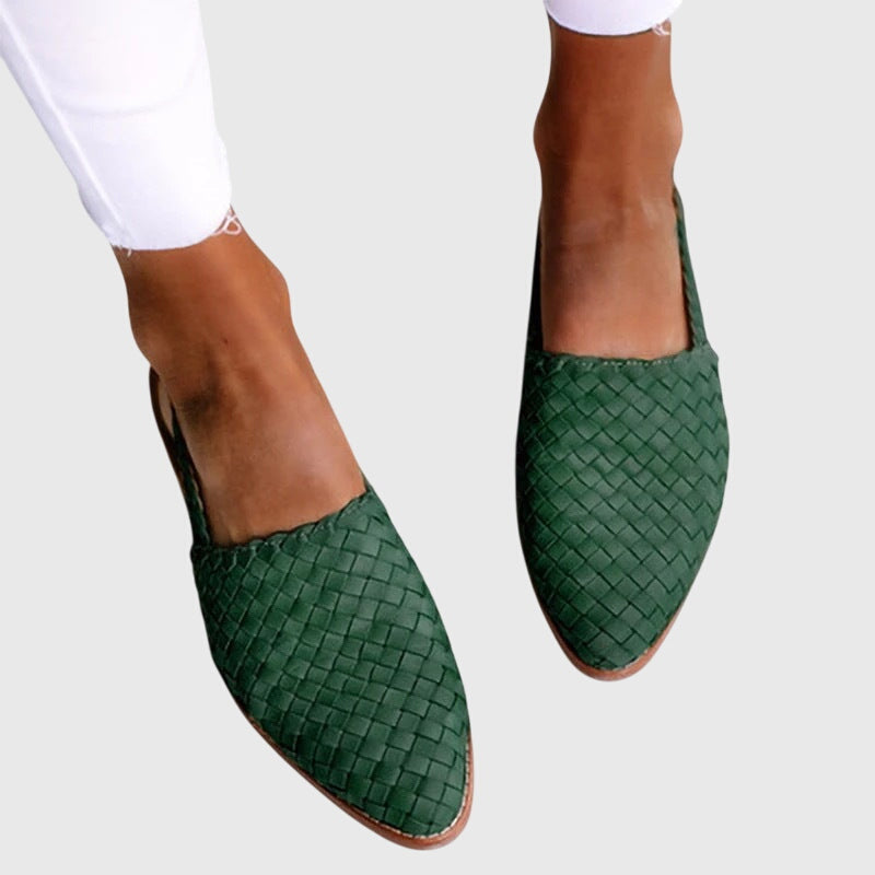 Green - Women's flat slip-on mules featuring a woven faux-leather upper and closed almond toe design.
