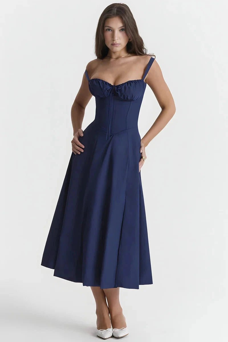 Navy Blue Linsay - Woman wearing a floral sweetheart midi dress with wide straps, a fitted bodice, and a flowing A-line skirt with a front slit.