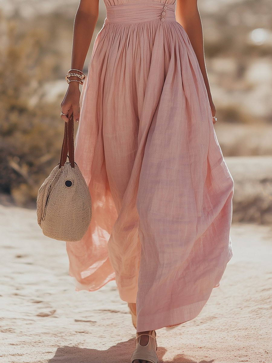 Teal - Woman walking outdoors in a desert landscape wearing a lightweight, sleeveless plunging V-neck maxi dress with a wide banded waist and side button details.